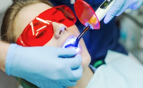 Patient receiving dental sealants during children's dentistry visit