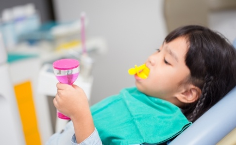 Child receiving fluoride treatment