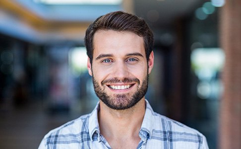 Man smiling after dental implant salvage in Las Vegas, NV