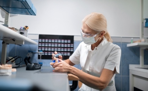 Technician crafting a dental implant restoration