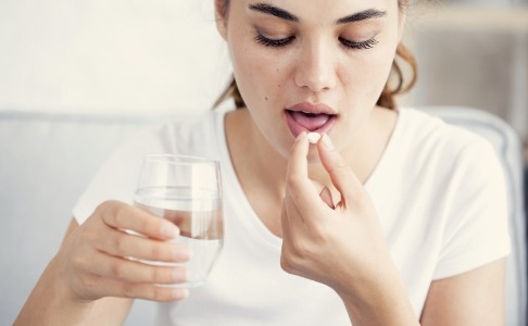 Patient taking oral conscious sedation dentistry pill