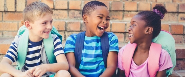 Kids laughing together after children's dentistry visit