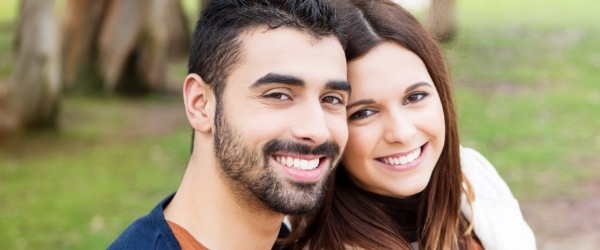 Man and woman smiling after relaxing sedation dentistry visit