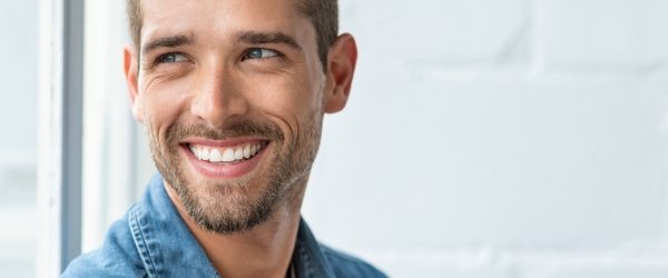 Man with healthy smile after T M J therapy