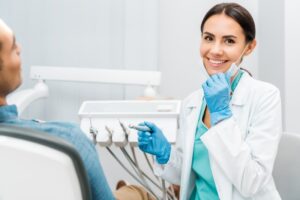 Dentist working with patient.