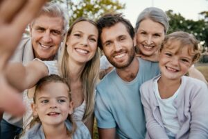 Three generations of family posing for a photo
